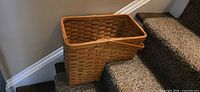 Front view of woven wood step basket on stairs