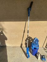 Full view of pole saw, portable fan, extension pole