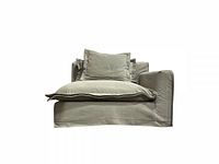 Studio image of beige slipcovered sectional piece with cushions