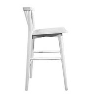 Side profile of white spindle-back counter stool