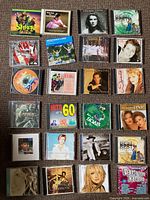Twenty of the 59 CDs laid out showing cover art and jewel cases