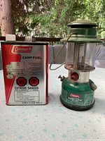 Lantern beside fuel can, front view