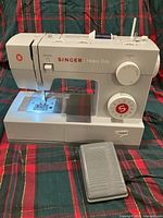Front view of Singer 4423 sewing machine with foot pedal