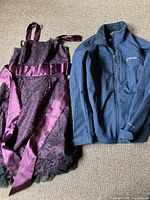 RW&CO purple lace dress and Columbia jacket displayed side by side