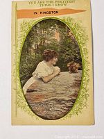 Front of postcard showing image, caption and border