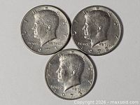 Three Kennedy Half Dollars obverse sides dated 1971, 1972, 1973