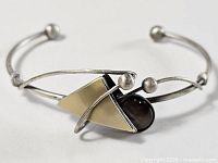 Full view of cuff bracelet showing overall design and open end