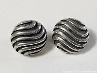 Full view of both sterling silver wave earrings