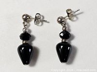 full view of both earrings showing components and overall condition