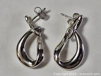 full view of both sterling silver modernist earrings