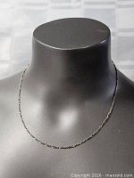 Front view of entire necklace on display bust