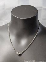 Necklace on display bust showing full drape and pendant position