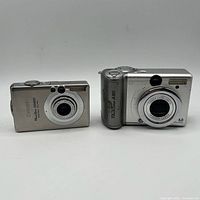 Front view of both cameras showing lenses and model markings