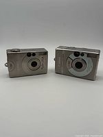 Front view of both Canon PowerShot S110 and S300 cameras