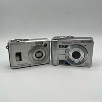 Front view of both cameras showing lens area and model markings