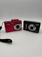 Front view of both cameras showing lenses, flash and branding