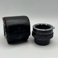 Tele-converter with closed leather case front view