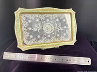 Top view green frame tray with ruler for scale