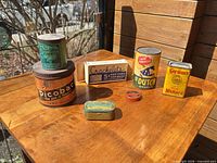 All eight items arranged on table in sunlight