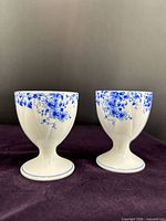 Front view of both Shelley Dainty Blue egg cups