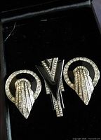 Set inside display box showing earrings and pendant