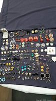 Full layout of entire earring collection on cloth