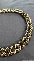 full view of necklace showing bead and chain pattern