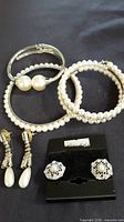 Group shot of all bracelets and earrings