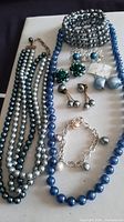 Group shot showing necklaces, bracelets and earrings