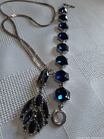 Necklace and bracelet side by side showing overall design