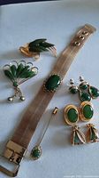 All jewellery items grouped: bracelet, brooches, stick pin, earrings