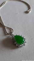 Front view of necklace showing jadeite pendant and chain
