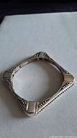 Full view of square silver-plated bracelet front