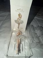 Front view of ornament beside original Hallmark Keepsake box