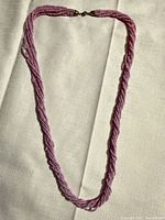 Full view of twisted pale purple seed bead necklace