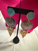 Front view of the dangle earrings showing all components and colors