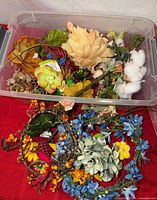 Overall view of bin filled with various dried and faux floral pieces