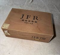 Closed cigar box top view showing JFR 770 L.E. branding and Maduro plaque