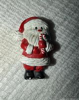 Front view of Santa brooch showing design and paint
