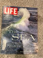 Front cover showing Life logo, wave photo, title "The Sea", price 35 cents