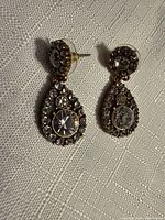 Front view of both earrings showing design and stones