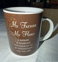 Front of brown mug showing text and pattern