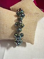 Front view of bracelet showing clustered faceted beads