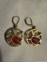 Front view of both earrings showing design and stones