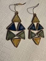 Full view of both dangle earrings showing design and colors
