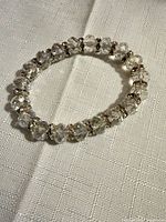 Full view of clear crystal stretch bracelet laid flat