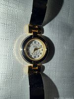 Front view of Kathy Ireland two-tone wristwatch showing dial and bracelet segments