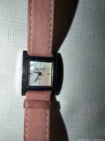 Front view of Skagen watch face and pink suede strap