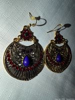 Front view of both earrings showing full design, stones, and crystals