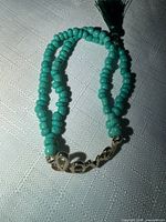 Bracelet overall view showing beads, love connector and tassel